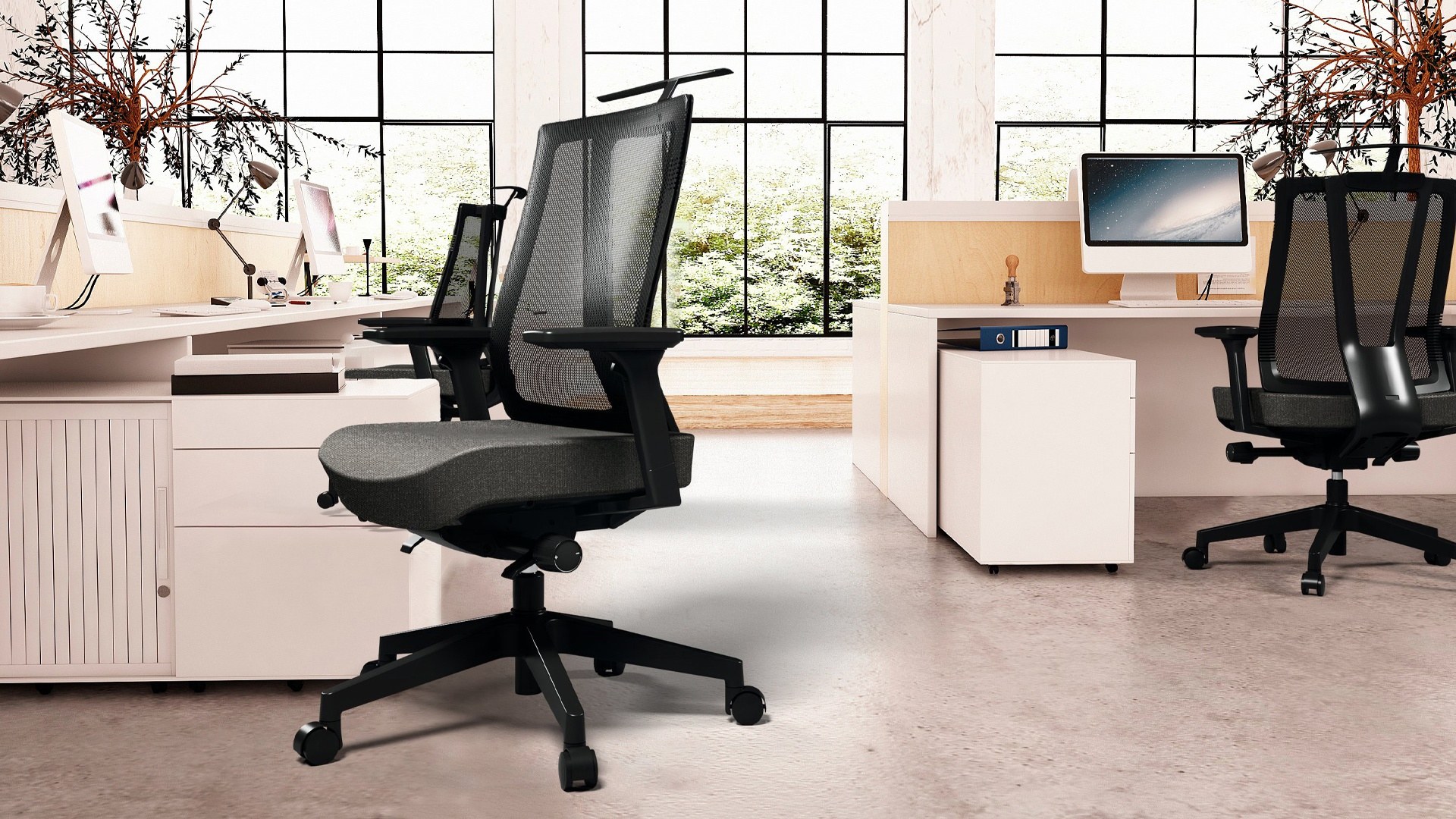 Ergonomic monitor arm and keyboard tray on a clean desk